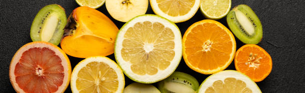 istock A close up of many different types of fruit, including oranges, kiwis, and grapefruit 2202456583