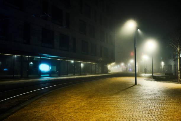 istock Empty night scene street with tracks for lightrail car 2202456840