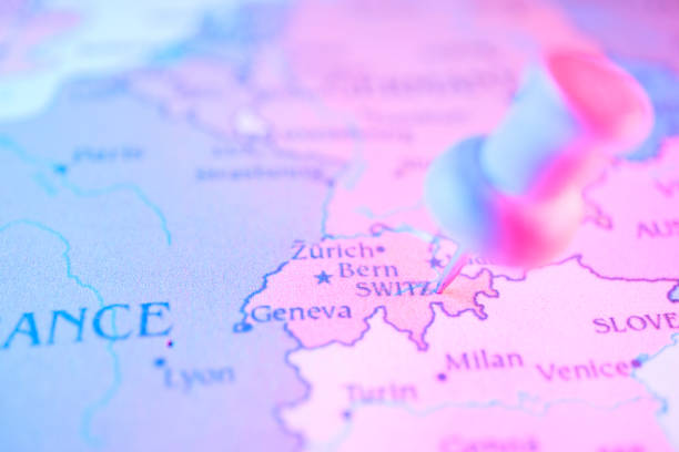 A yellow pushpin marks a spot on a detailed map of Europe, highlighting the borders and cities of various countries including France, Germany, and Switzerland.