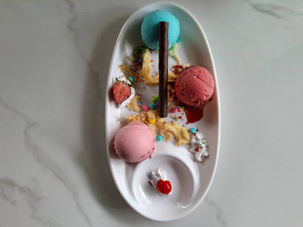 Yummy Ice Cream With Bubblegum Cream, Raspeberry Cream, Strawberry Cream, Whipped Cream, Cotton Candy, Chewing Gum Candy, Strawberry Fruit And Chocolate Stick. Dessert Food Menu. Top View.