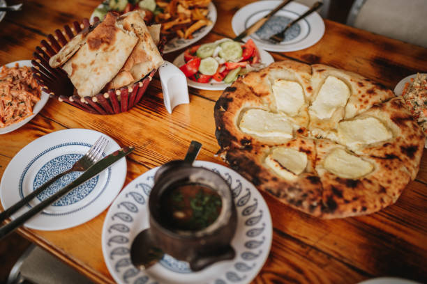 istock Georgian cuisine. Khachapuri and soup 2202464047