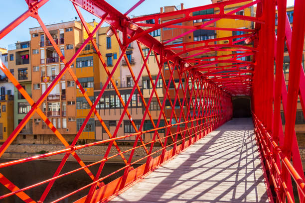 Red iron bridge or Girona Eiffel Bridge (Pont de les Peixateries velles, 1877) in Girona, Catalonia, Spain