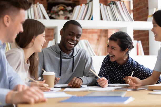 istock Smiling multiethnic students laugh studying in classroom together 2202466174
