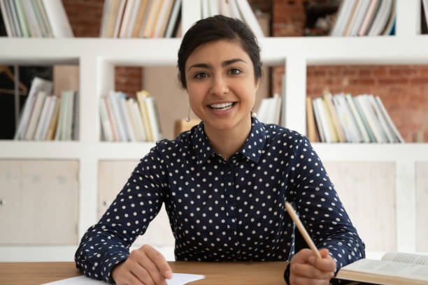istock Indian female coach talk on camera shooting online course 2202468044