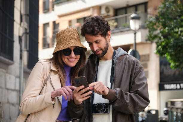 istock Tourists using smartphone to navigate in city 2202468544