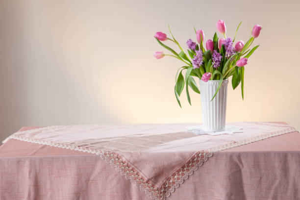 istock spring flowers in white vase in vintage style 2202472450