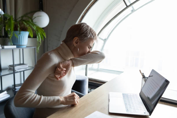 istock Unhealthy female employee cough get coronavirus symptoms 2202472674