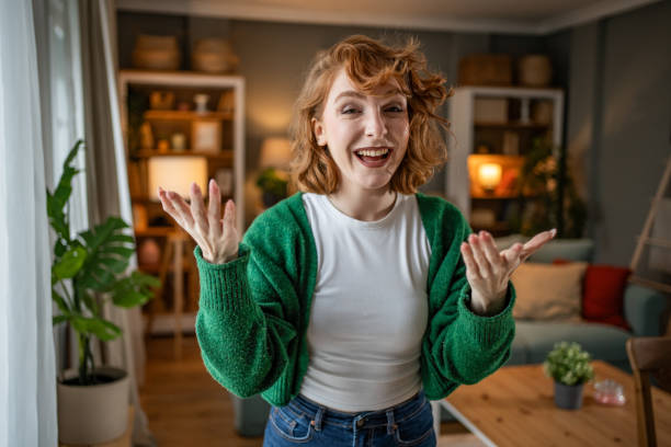 istock Enthusiastic young woman making a video call from home 2202472716