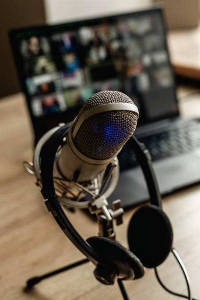 istock Microphone on the air and headphones for video conference calling on laptop computer 2202474899