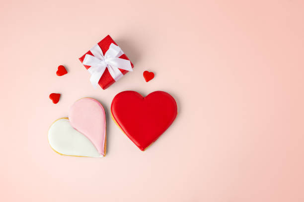 istock Valentines day background, love heart cookies and gift box 2202475271