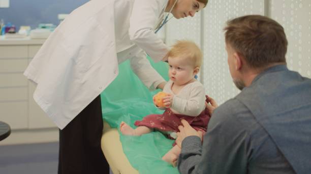istock The pediatrician examines the child with a stethoscope. 2202478460