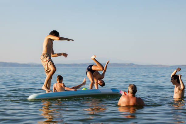 istock Surfboard Fun with Dad and Kids 2202480292