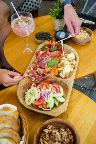 istock Charcuterie board with fresh salad and cheese selection 2202483880