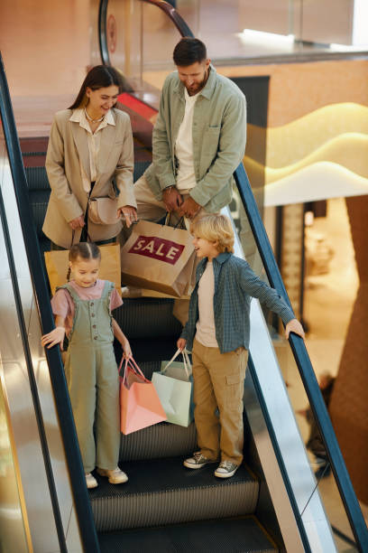 istock Family on Escalator in Shopping Mall 2202493008