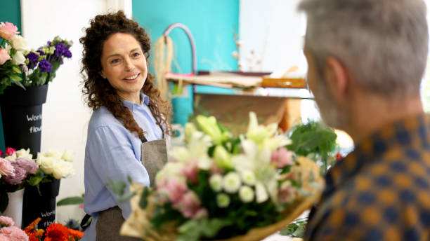 istock Florist listening to customer's preferences 2202495165