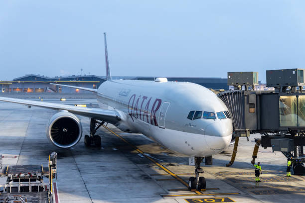 Doha, Qatar - February 18, 2025 : Qatar Airways Boeing 777-300ER at Hamad International Airport in Doha, Qatar.