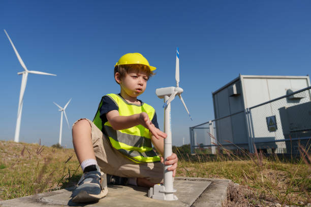 istock Young engineers are investigating the operation of natural energy systems such as wind turbines and electric power. 2202511134