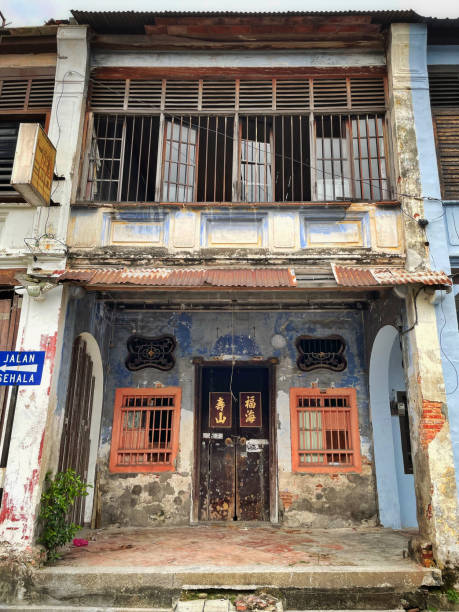 Georgetown, Penang, Malaysia - October 21, 2022: The front facade of a traditional Chinese shophouse in Georgetown, a UNESCO World Heritage Site, showcasing its historic architectural charm.