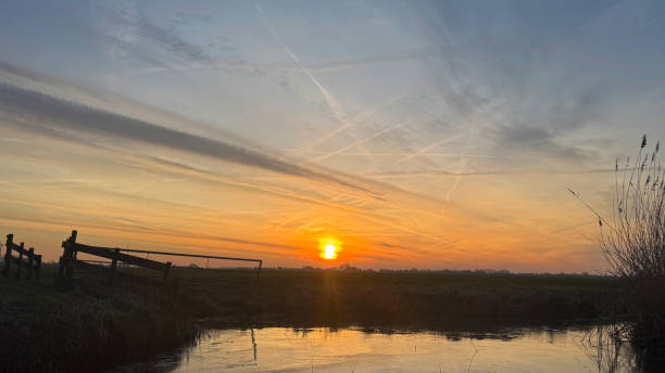 Sunrise on the meadow in the winter
