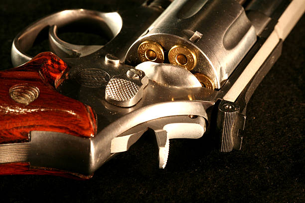 KAL .375 magnum revolver shows the 6-shot cylinder, lying on a table, illuminated from the front with artificial studio light,