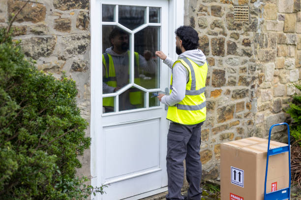 istock Knocking On The Door With A Parcel 2202516494