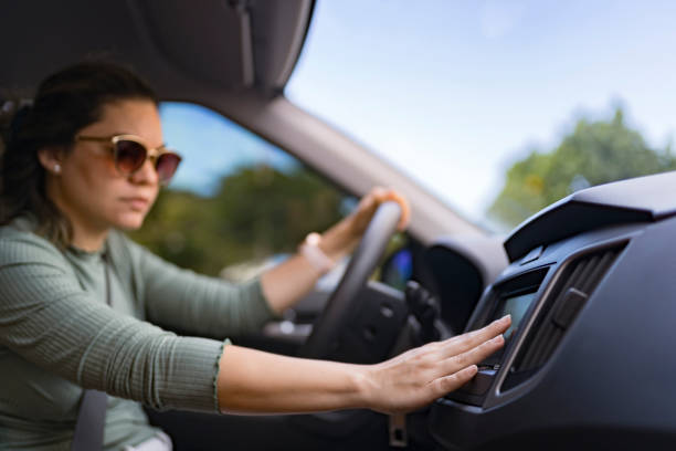 istock Woman touching car dashboard 2202516987
