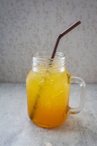 istock soft drink in glass jar with straw , summer drink 2202518962