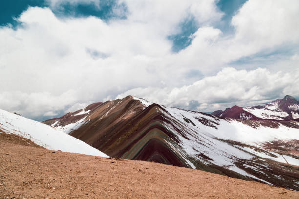 istock Vinicunca or rainbow mountain partially covered with snow in peru 2202519646