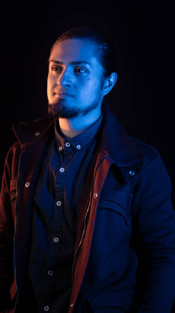 istock Thoughtful Man in Cinematic Blue and Warm Lighting 2202519904