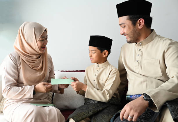 istock Eid Blessings: A Malay Kid Seeks Forgiveness and Celebrates with Family 2202522014