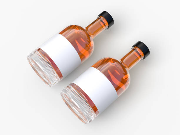 istock Realistic 3D glass bottle mockup, isolated with blank label, lid and liquid within. Mockups container for alcohol drink, water, liquid product, shampoo, beer, soda, vegetable oils or juice glassware 2202522613