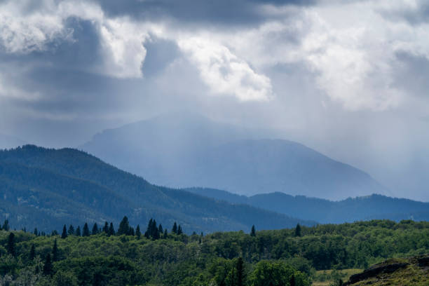 Rain falling on overlapping forested ridges of the blue ridge mountains of north carolina