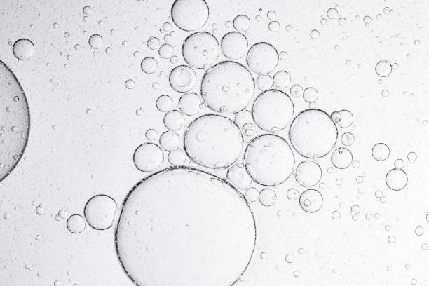 Macro bubble backdrop,Macro bubbles,Effervescent fizz and clean cosmetics hygiene or rejuvenate renewable energy. Studio shot of transparent cosmetic blue gas bubbles under water in full-frame macro close up with selective focus blur.