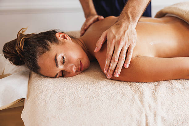istock Woman Enjoying Massage In Spa Centre 2202530116