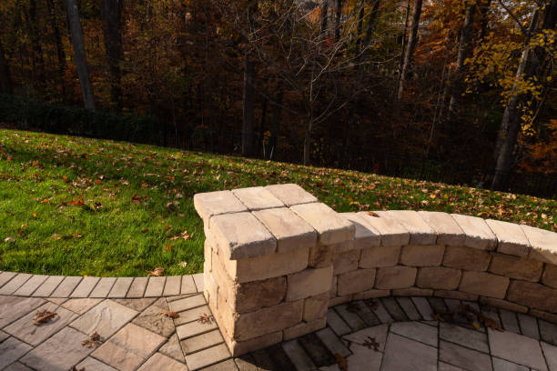 istock Curved Stone Wall in Autumn Backyard 2202530349