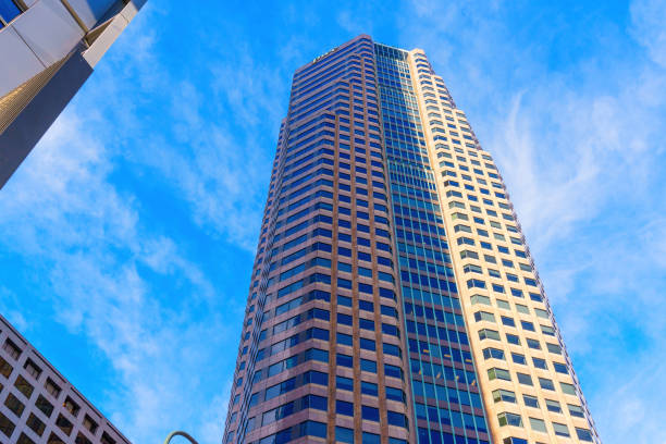 Los Angeles, California - January 7, 2025: Striking upward view of Figueroa at Wilshire Tower against a bright blue sky, showcasing modern architecture in downtown Los Angeles.