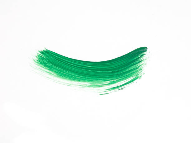 istock Bright green paint stroke on white background 2202531343