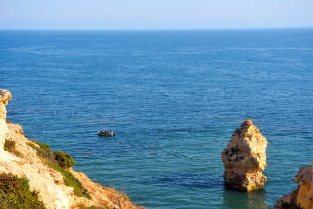 walking path with breathtaking views through the coast from porches to benagil caves lagoa algarve portugal