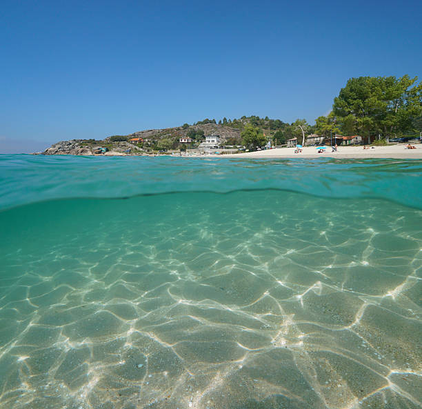 istock Atlantic coast beach with sand underwater in Spain over under water 2202532879