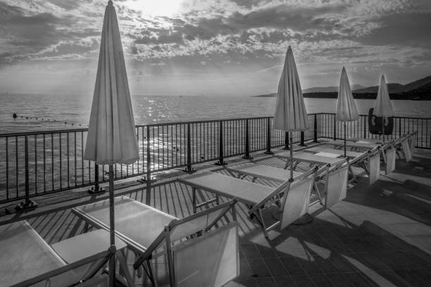 istock sMALL COMFORTABLE BEACH WITH BEACHCHAIRS ON fRENCH rIVIERA 2202533857