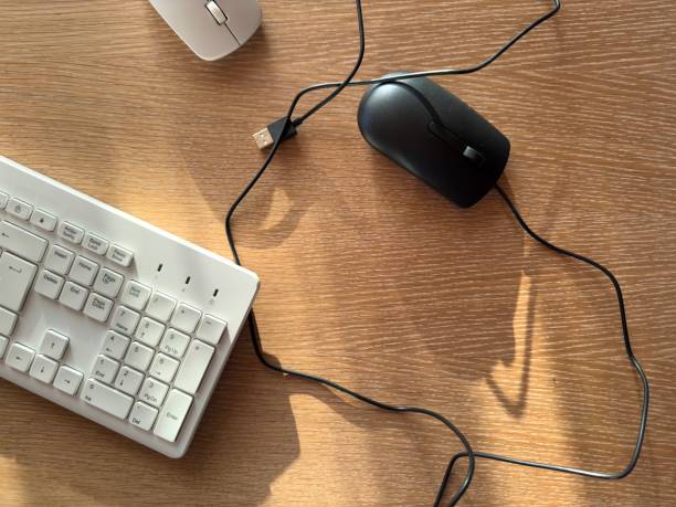 istock Office wireless white keyboard and wireless white mouse with broken wired old black mouse that no longer works 2202533989