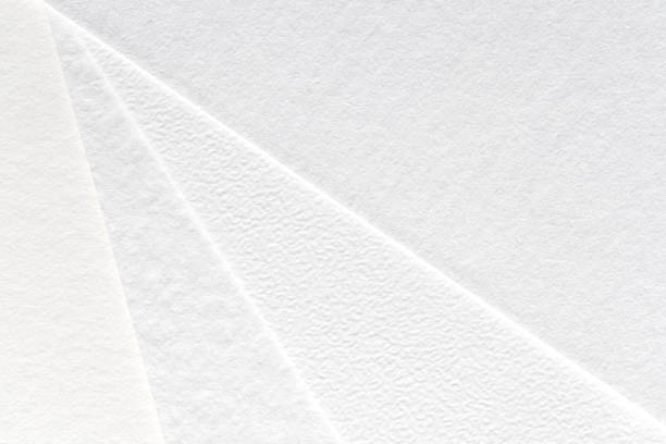 istock Close-up texture of white textured paper with overlapping layers for minimalist 2202534216