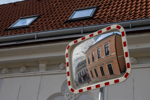 istock Orange classic building in a traffic mirror, Czechia 2202534697
