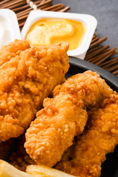 istock Chicken tenders. Fried chicken breast strips 2202534985