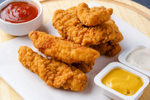 istock Chicken tenders. Fried chicken breast strips 2202534998