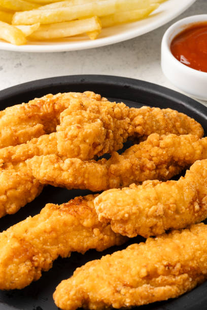 istock Chicken tenders. Fried chicken breast strips 2202535053