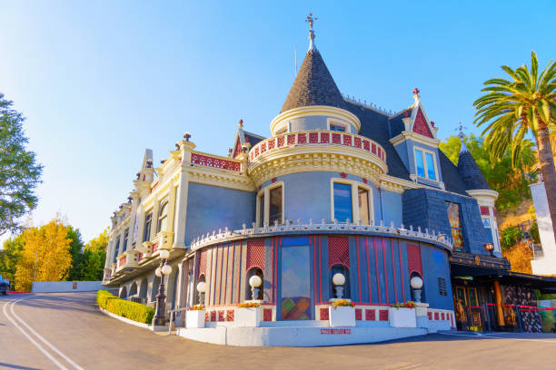 Los Angeles, California - January 8, 2025: Magic Castle stands majestically with distinctive architecture, palm trees, and a clear blue sky showcasing the iconic Hollywood landmark.