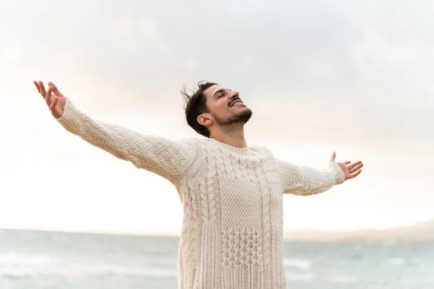 Man enjoying freedom at the beach