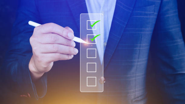 istock Businessman tick correct sign mark for document approve , project acceptance and quality assurance concept, take an assessment, questionnaire, evaluation, online survey online exam check list 2202542882