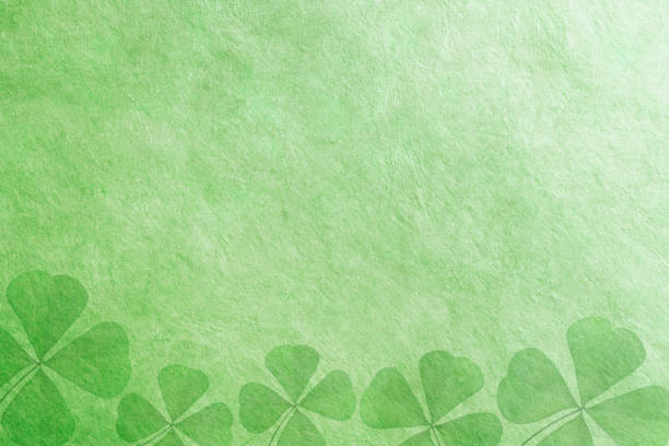 Shamrock shapes on a green background.